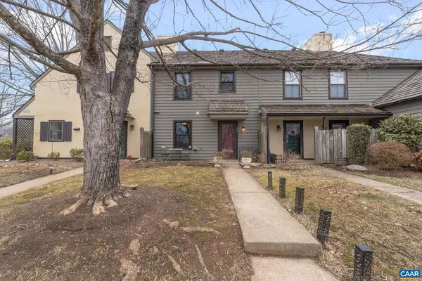 a front view of a house with a fence