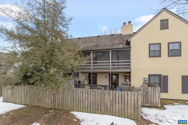 a sign that is sitting in front of flowers