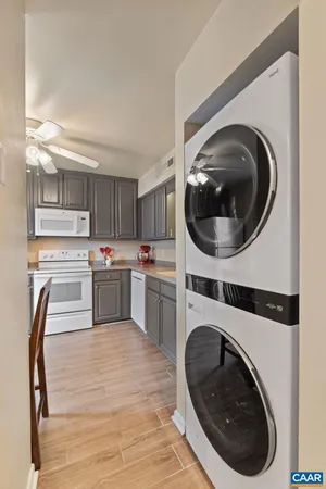 a kitchen with a refrigerator sink and cabinets