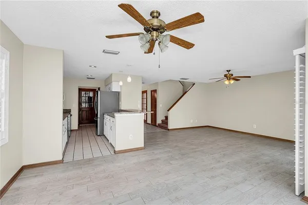 an entryway and a livingroom with furniture