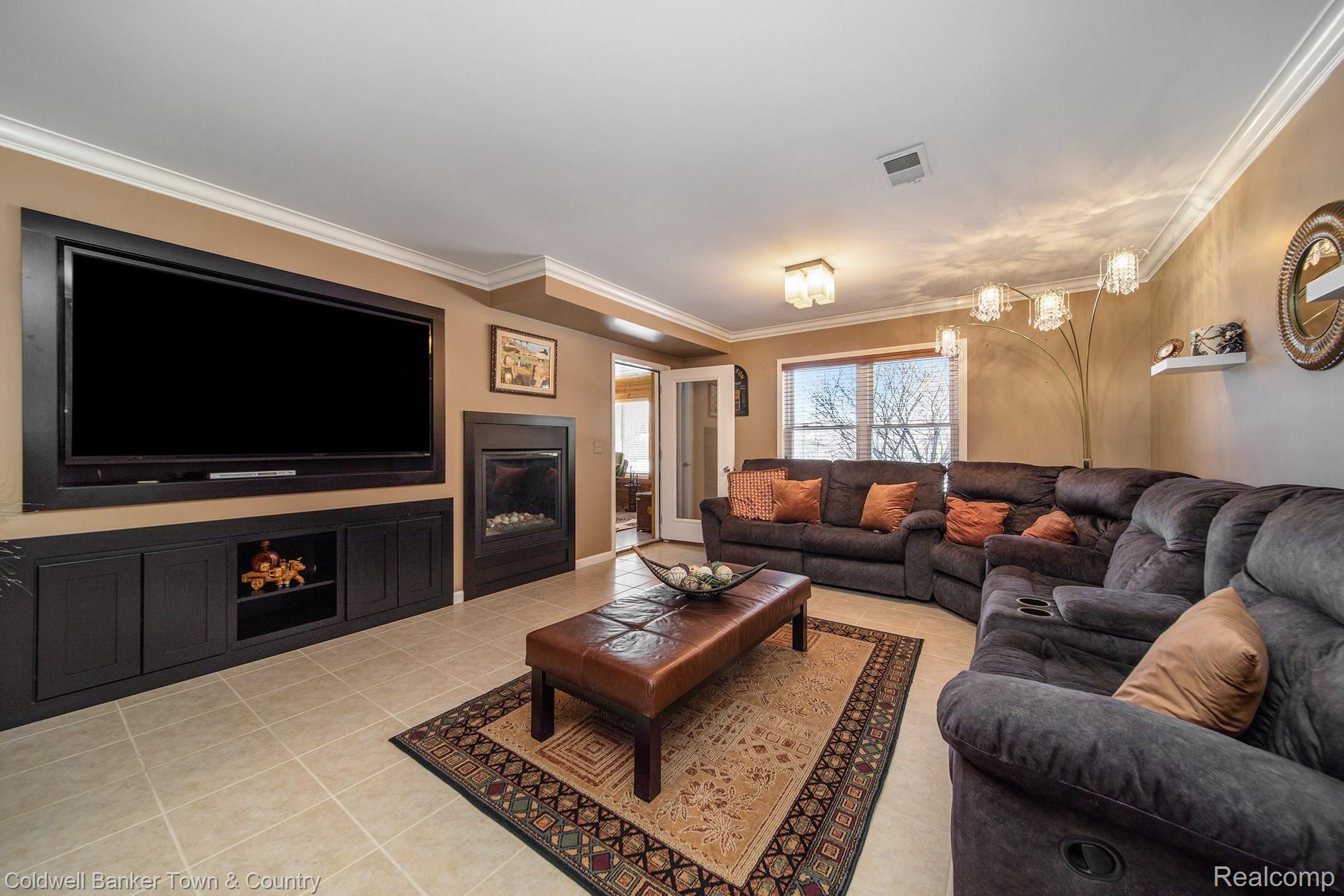 7143 Perry Lake Road Clarkston, MI 48346 - Photo 26 of 35 Built In Entertainment and Fireplace