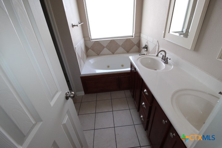 1804 Walker Pl Boulevard Copperas Cove, TX 76522 - Photo 11 of 12 a bathroom with a sink a bathtub and a shower