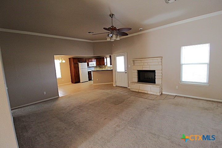 1804 Walker Pl Boulevard Copperas Cove, TX 76522 - Photo 2 of 12 an empty room with fireplace and windows