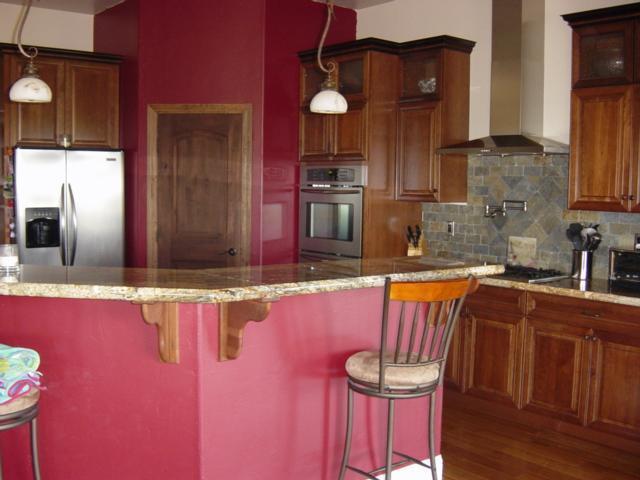 22175 Lone Tree Road Anderson, CA 96007 - Photo 2 of 7 a kitchen with stainless steel appliances granite countertop a sink dishwasher and cabinets with wooden floor