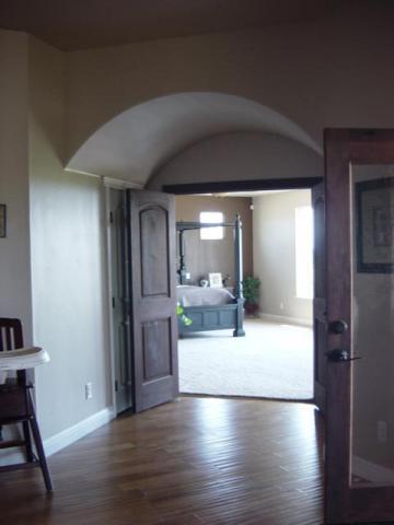 22175 Lone Tree Road Anderson, CA 96007 - Photo 4 of 7 a view of a living room with wooden floor