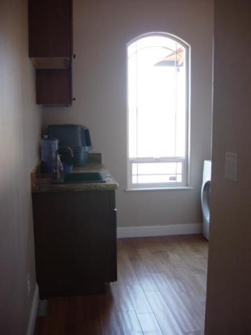 22175 Lone Tree Road Anderson, CA 96007 - Photo 5 of 7 a room with a window and wooden floor