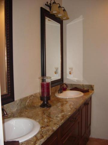 22175 Lone Tree Road Anderson, CA 96007 - Photo 7 of 7 a bathroom with a granite countertop sink and a mirror