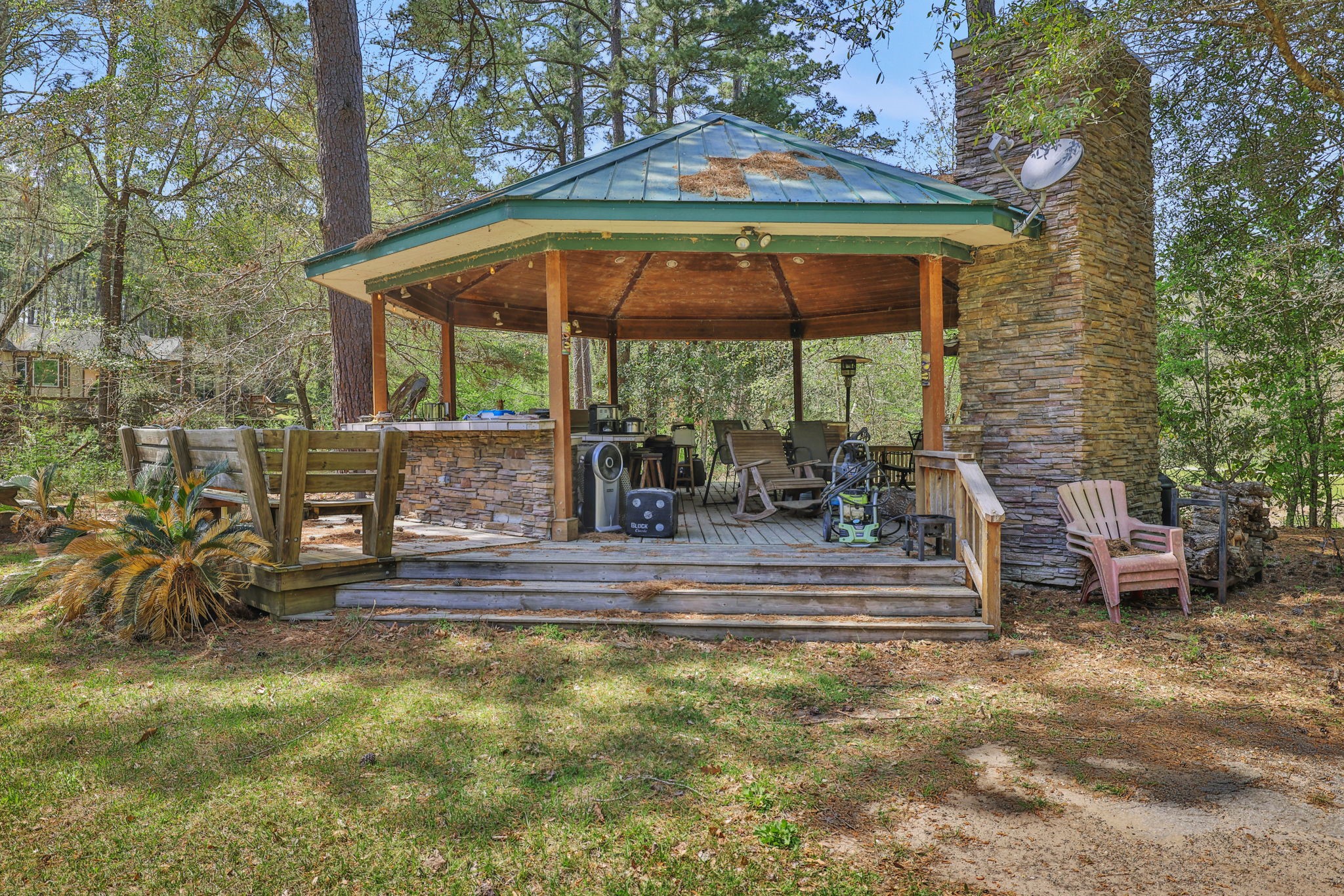 250 Critter Creek Road Coldspring, TX 77331 - Photo 21 of 48 Pavilion features a grill, dining /sitting area, fireplace