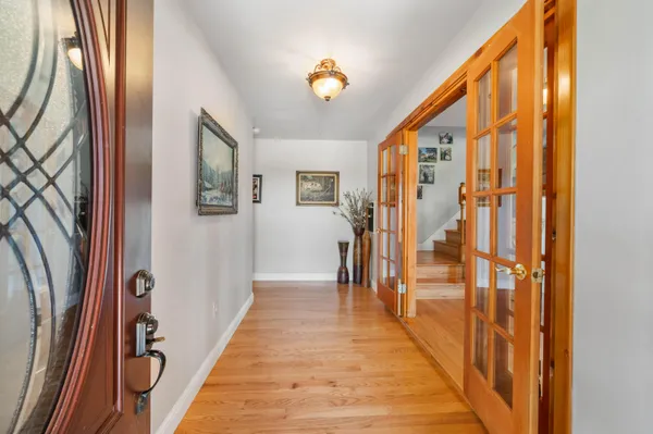 a kitchen with stainless steel appliances granite countertop a refrigerator stove top oven and sink