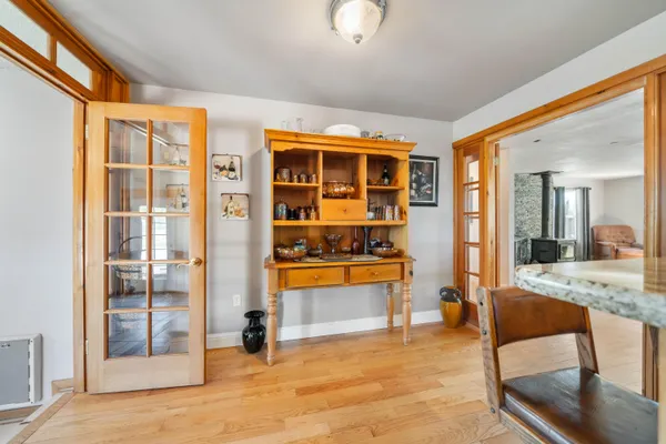 a spacious bedroom with a bed and a ceiling fan