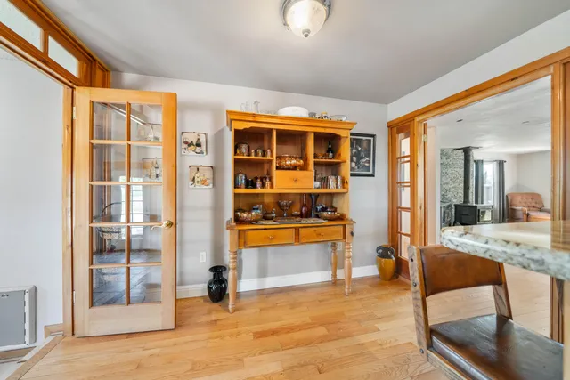 a spacious bedroom with a bed and a ceiling fan