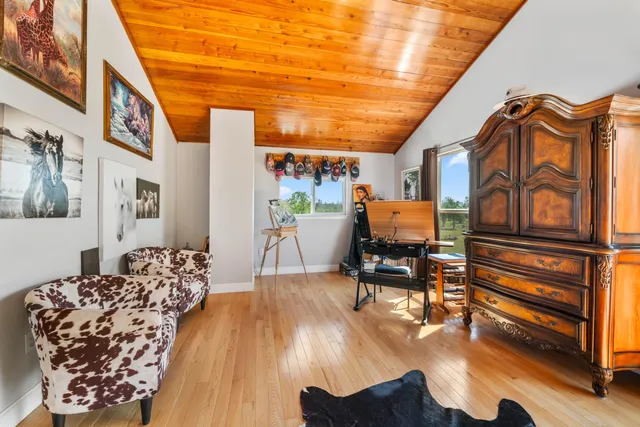 a view of house with swimming pool yard and outdoor seating