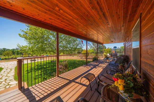 a view of balcony with furniture and wooden deck