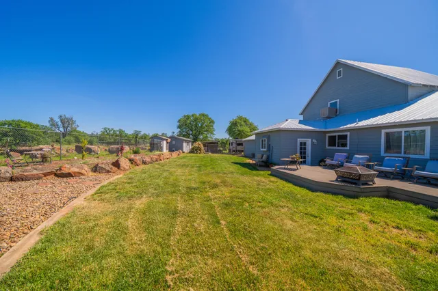 an aerial view of a house with outdoor space