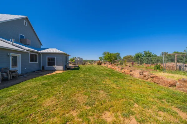 an aerial view of a house with outdoor space