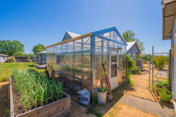 an aerial view of a house with a garden