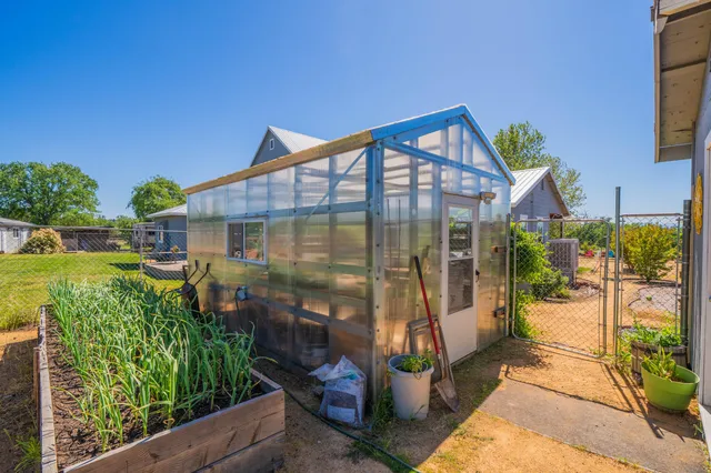 an aerial view of a house with a garden
