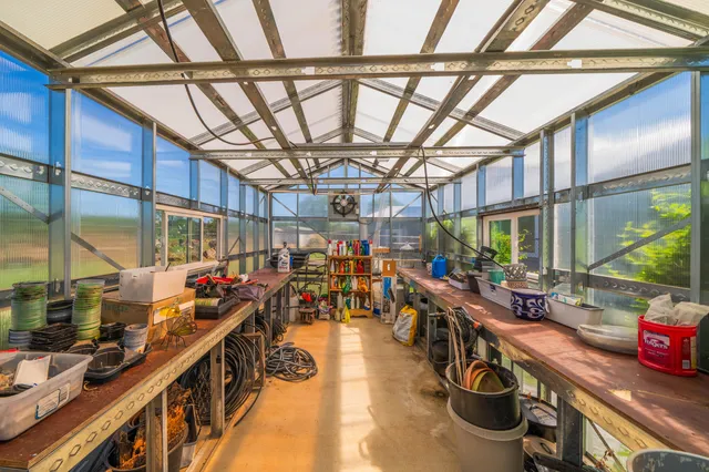 an aerial view of residential houses with outdoor space and swimming pool