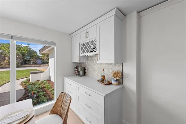a view of cabinets a sink and a window in a room