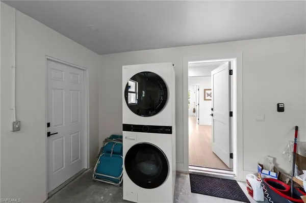 a bathroom with a granite countertop toilet sink and mirror