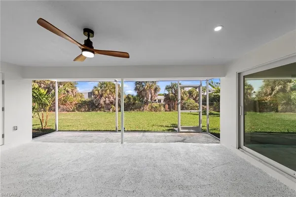 a view of a room with a big yard
