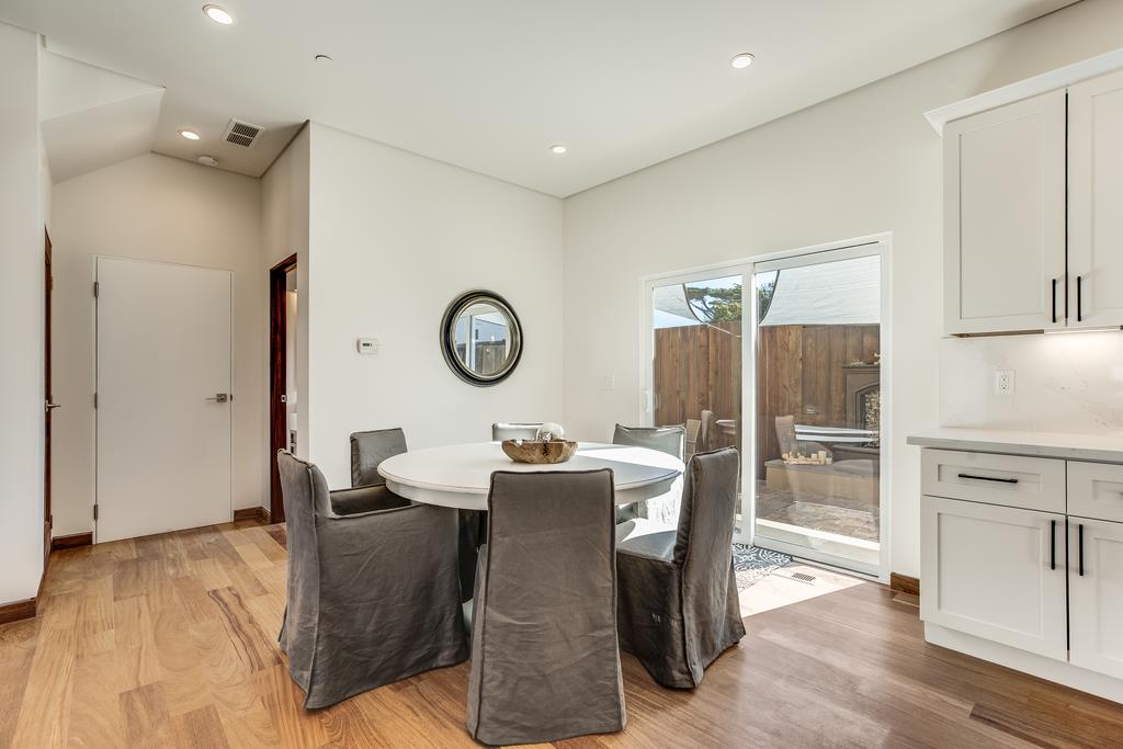 61 Elder Lane Pacifica, CA 94044 - Photo 11 of 37 a view of a dining room with furniture and a wooden floor