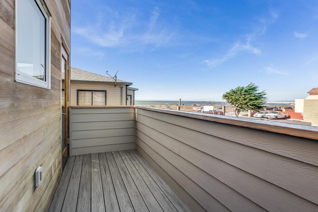 61 Elder Lane Pacifica, CA 94044 - Photo 16 of 37 a view of a balcony with wooden floor and fence