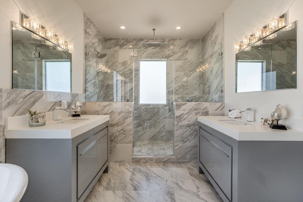 61 Elder Lane Pacifica, CA 94044 - Photo 18 of 37 a bathroom with a sink double vanity and a mirror