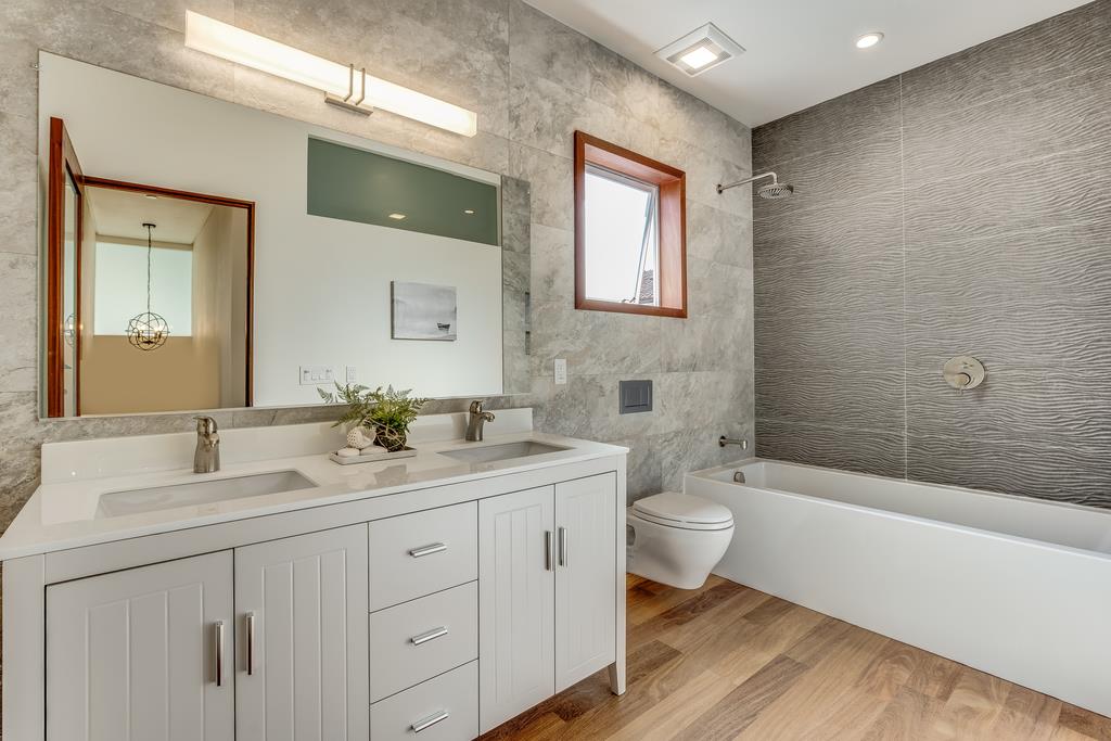61 Elder Lane Pacifica, CA 94044 - Photo 20 of 37 a bathroom with a double vanity sink toilet and shower