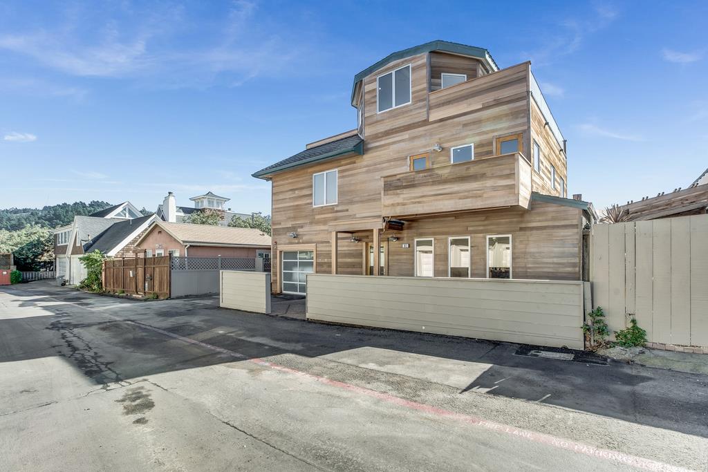 61 Elder Lane Pacifica, CA 94044 - Photo 2 of 37 a view of a house with a wooden fence