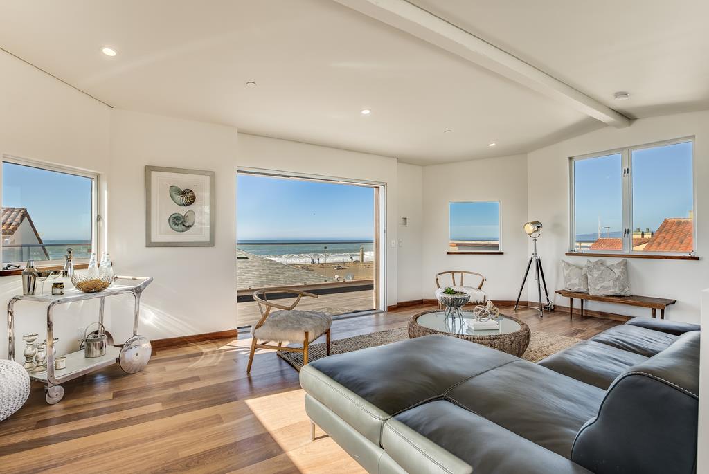 61 Elder Lane Pacifica, CA 94044 - Photo 23 of 37 a living room with furniture and wooden floor