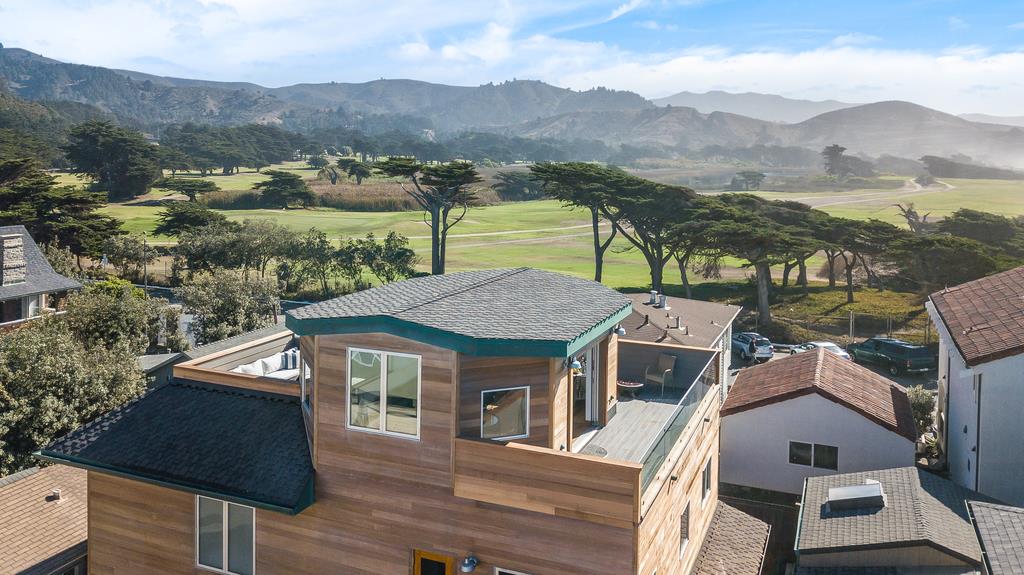 61 Elder Lane Pacifica, CA 94044 - Photo 33 of 37 an aerial view of a house with a mountain