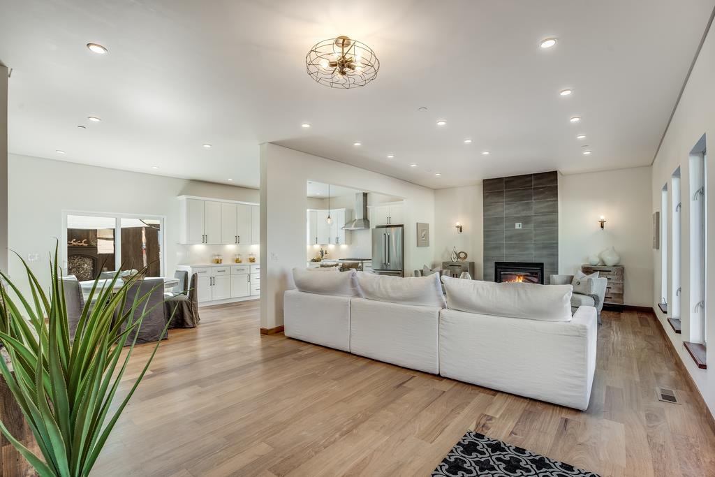 61 Elder Lane Pacifica, CA 94044 - Photo 4 of 37 a living room with furniture a wooden floor and a bookshelf