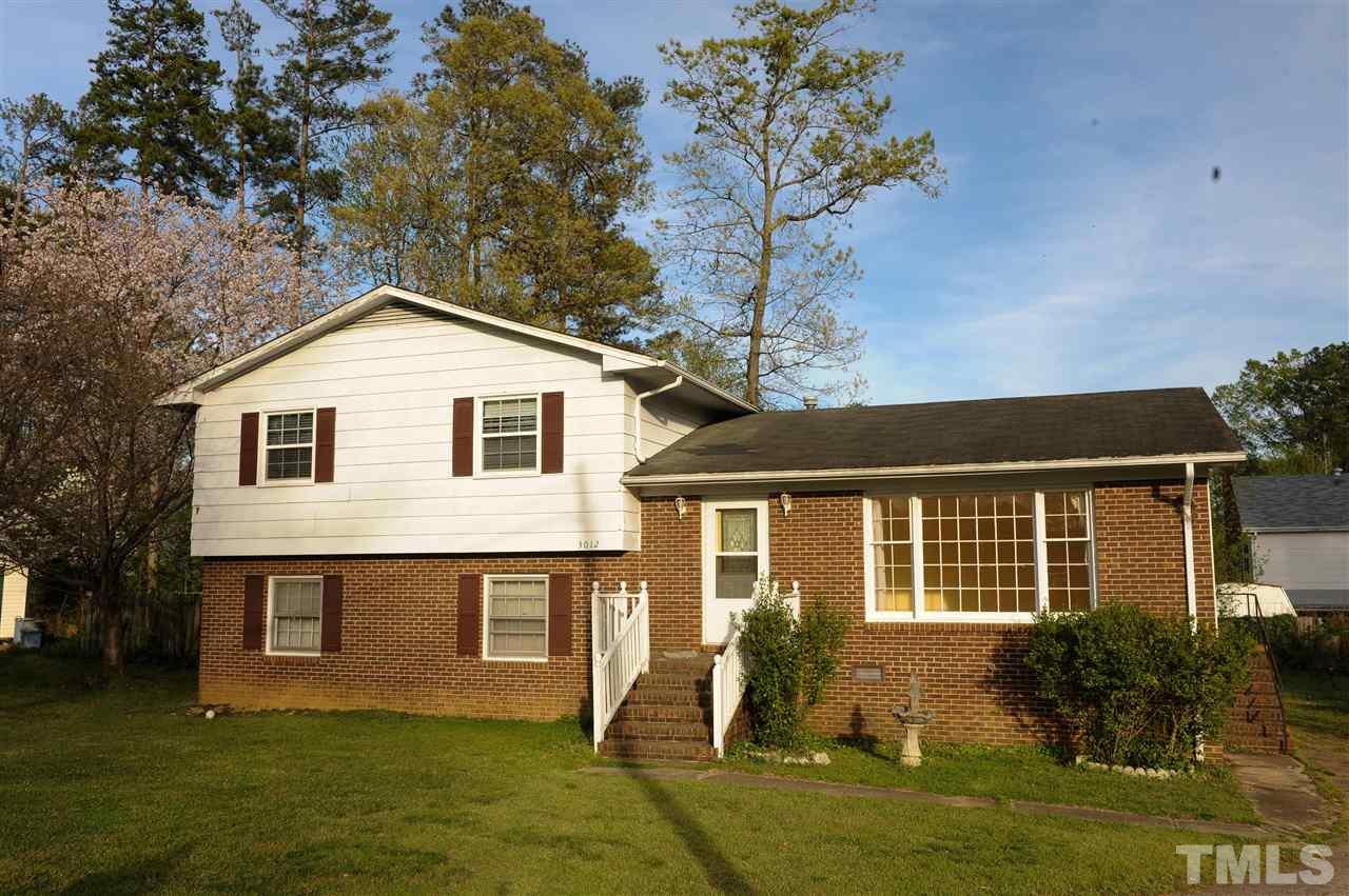 3012 Oldham Court Raleigh, NC 27604 - Photo 2 of 19 a front view of house with yard and green space