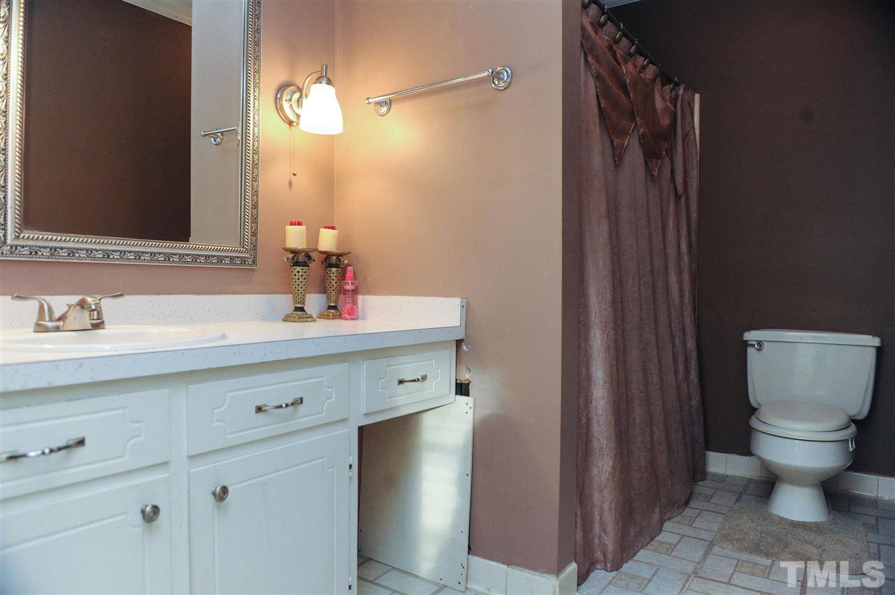 3012 Oldham Court Raleigh, NC 27604 - Photo 18 of 19 a bathroom with a sink toilet and shower