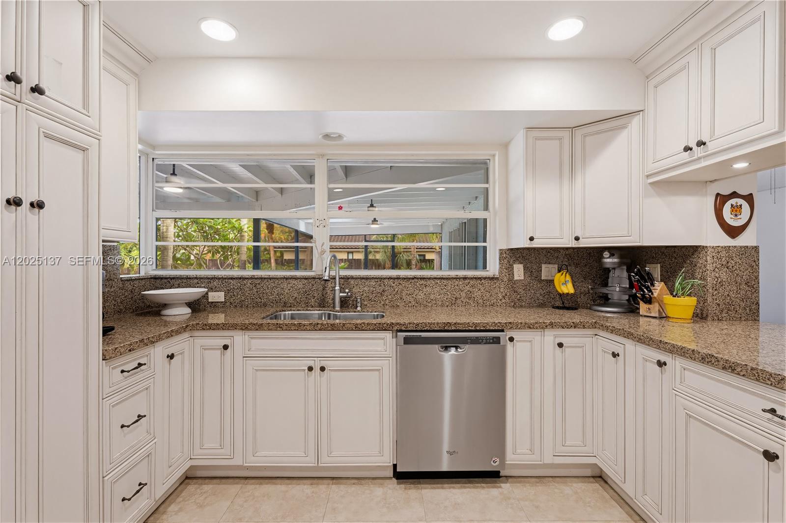 11480 Southwest 96th Terrace Miami, FL 33176 - Photo 10 of 54 a kitchen with granite countertop white cabinets and white appliances