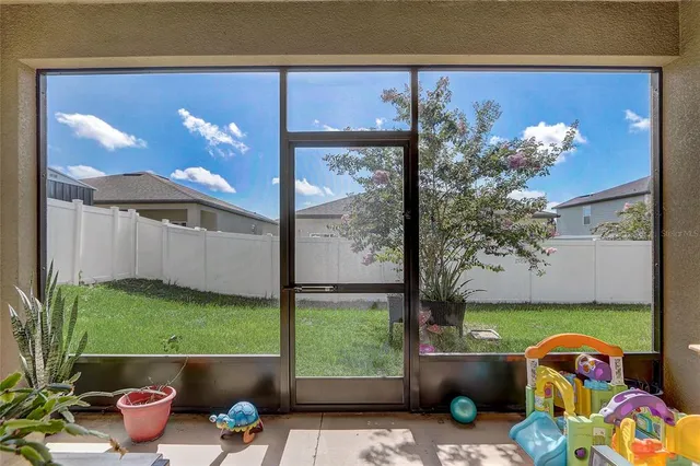 a balcony with furniture and garden view