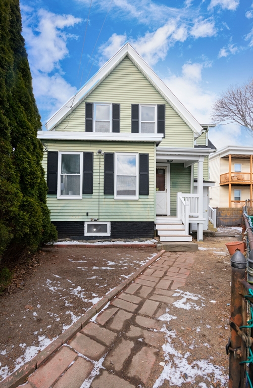 a front view of a house with yard