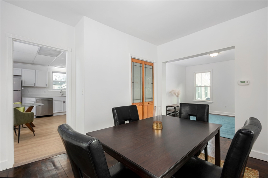 79 Brookline Street Lynn, MA 01902 - Photo 13 of 27 a view of a dining room with furniture and wooden floor