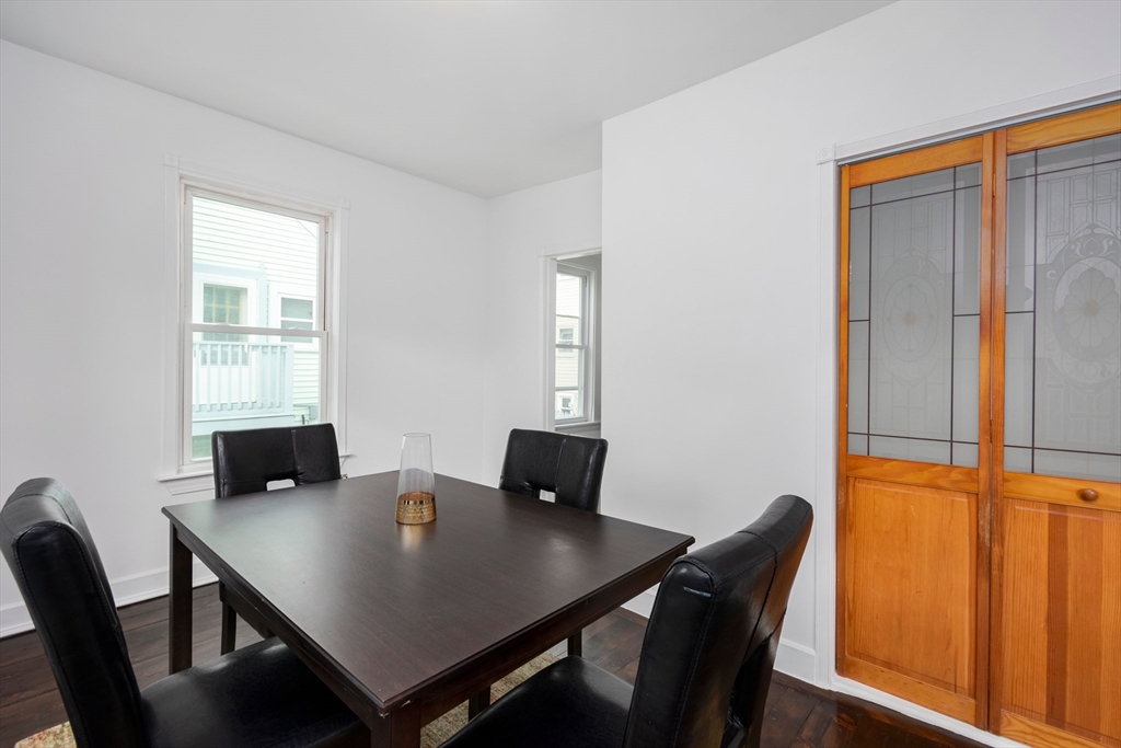 79 Brookline Street Lynn, MA 01902 - Photo 14 of 27 a view of a dining room with a table and chairs