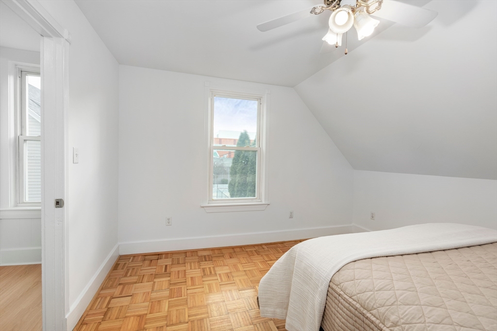 79 Brookline Street Lynn, MA 01902 - Photo 21 of 27 a bedroom with a bed and a window