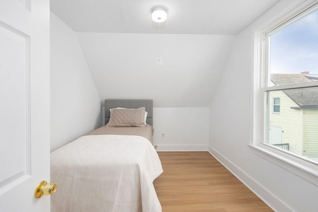 79 Brookline Street Lynn, MA 01902 - Photo 26 of 27 a bedroom with a bed and a window
