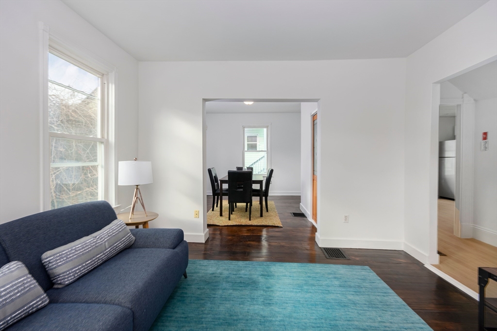 79 Brookline Street Lynn, MA 01902 - Photo 4 of 27 a living room with furniture and a large window