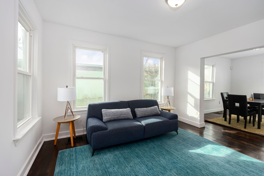 79 Brookline Street Lynn, MA 01902 - Photo 5 of 27 a living room with furniture and a wooden floor