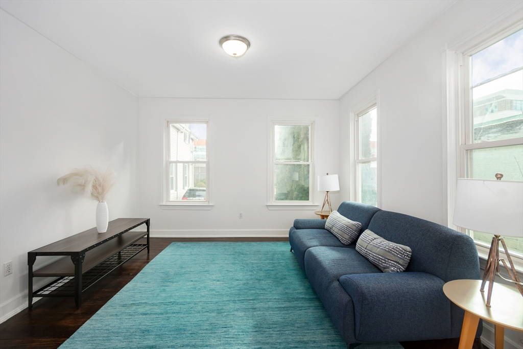 79 Brookline Street Lynn, MA 01902 - Photo 6 of 27 a living room with furniture and a window