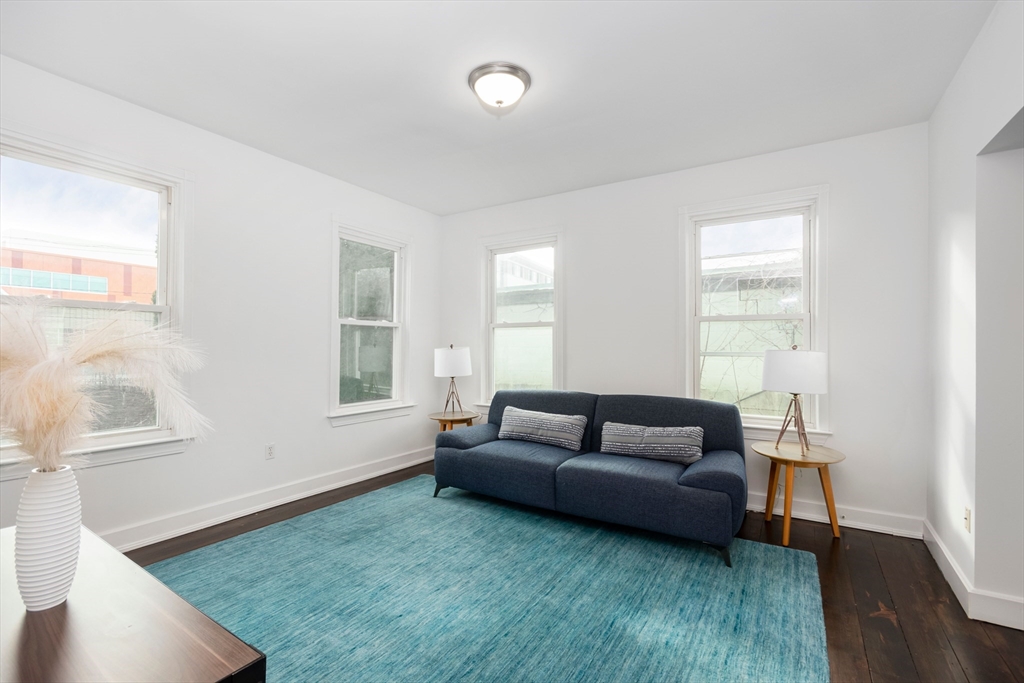 79 Brookline Street Lynn, MA 01902 - Photo 8 of 27 a living room with furniture and a window