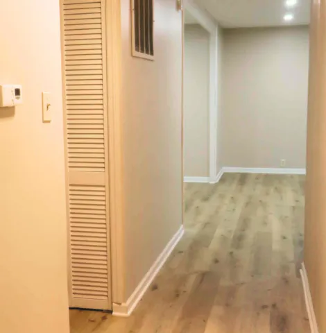 a kitchen with stainless steel appliances granite countertop a stove a sink and white cabinets