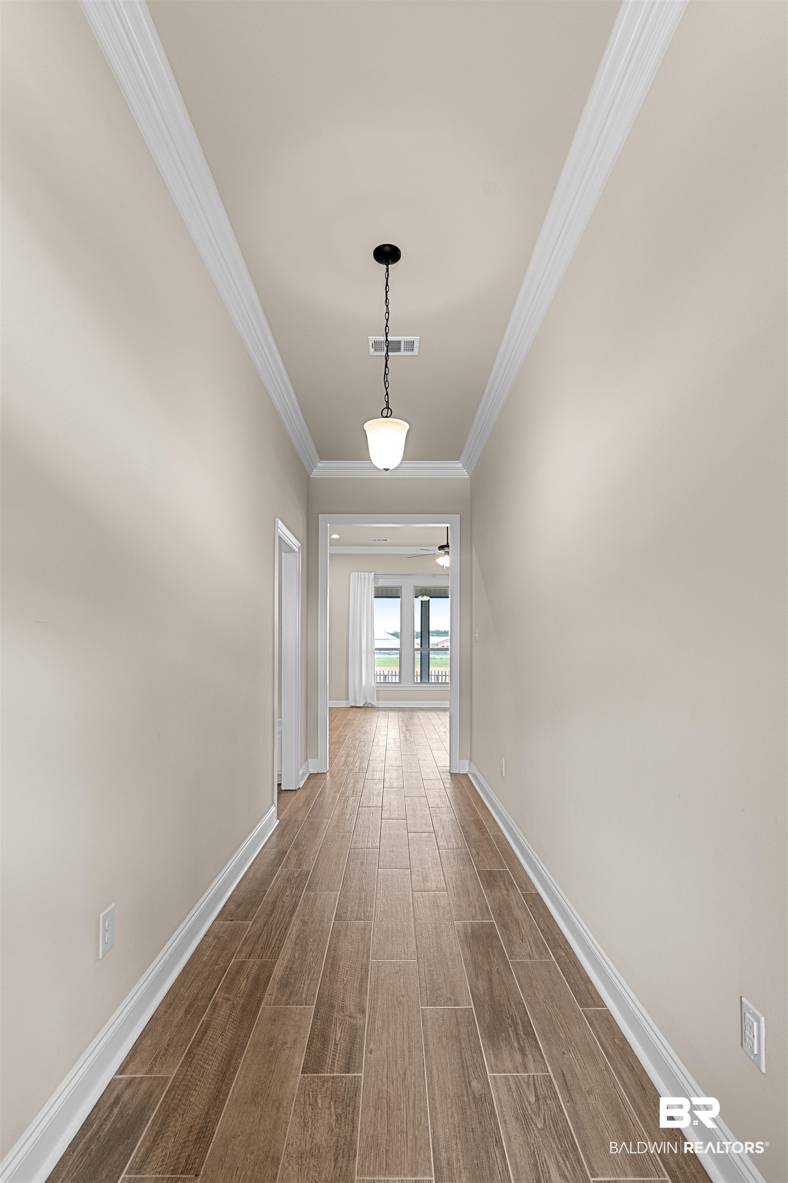 991 Dalton Circle Foley, AL 36535 - Photo 29 of 35 Corridor featuring wood finish floors and ornamental molding