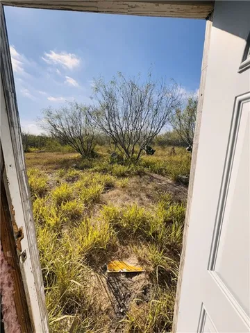 a view of a bathroom with a shower curtain