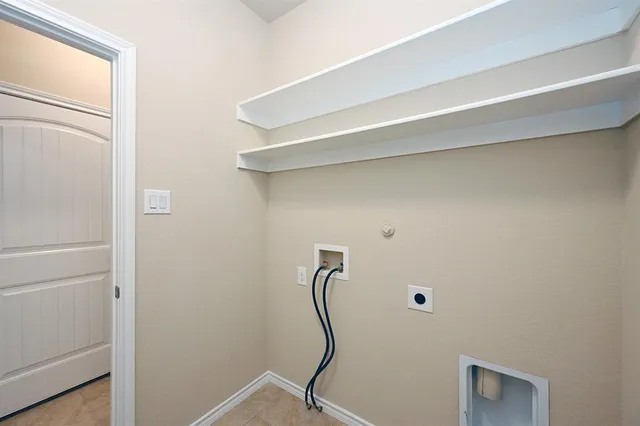 a room with a desk and wooden floor